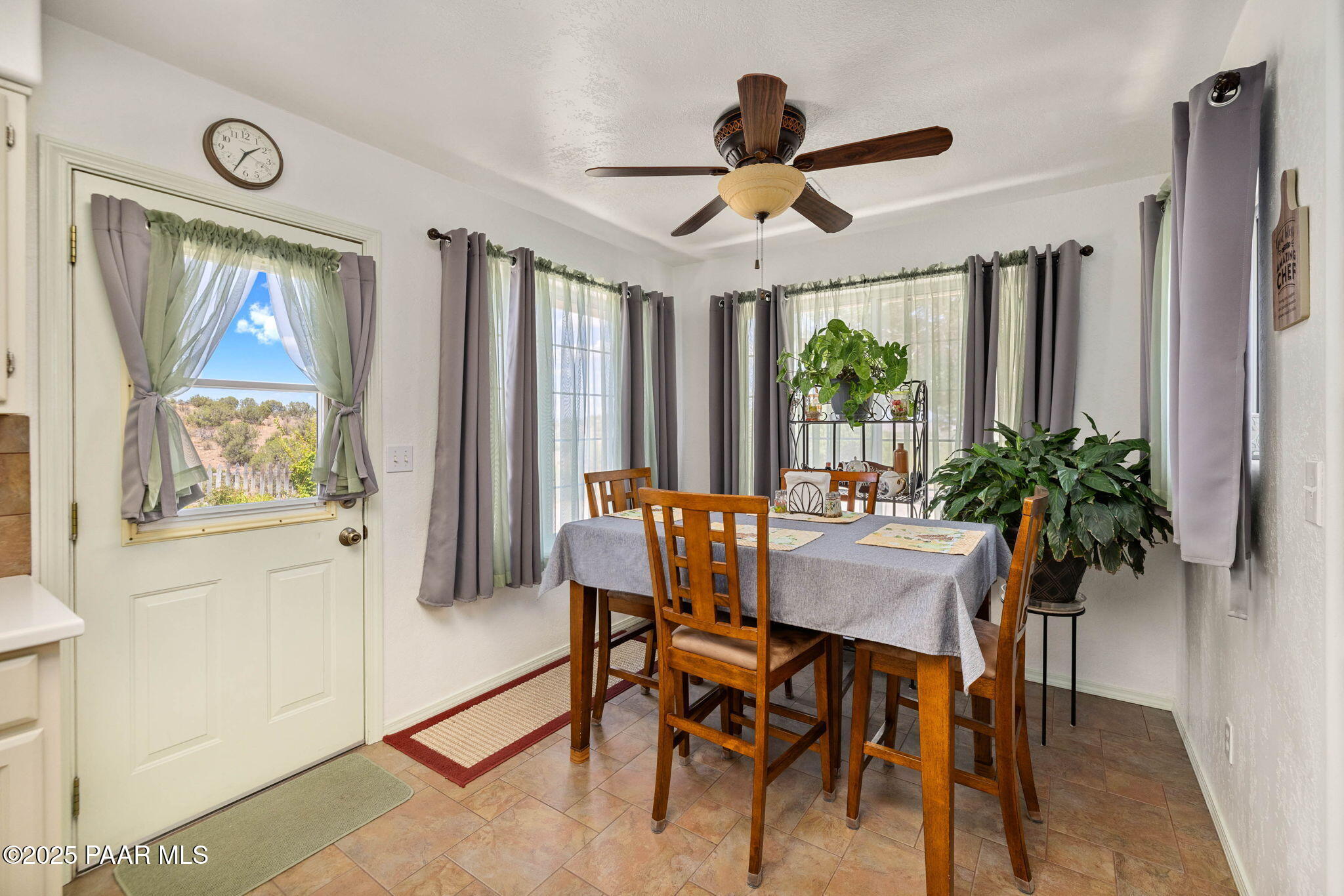 5400 North Skyhawk Road Chino Valley, AZ 86323 - Photo 12 of 26 a dining room with furniture a window and a chandelier