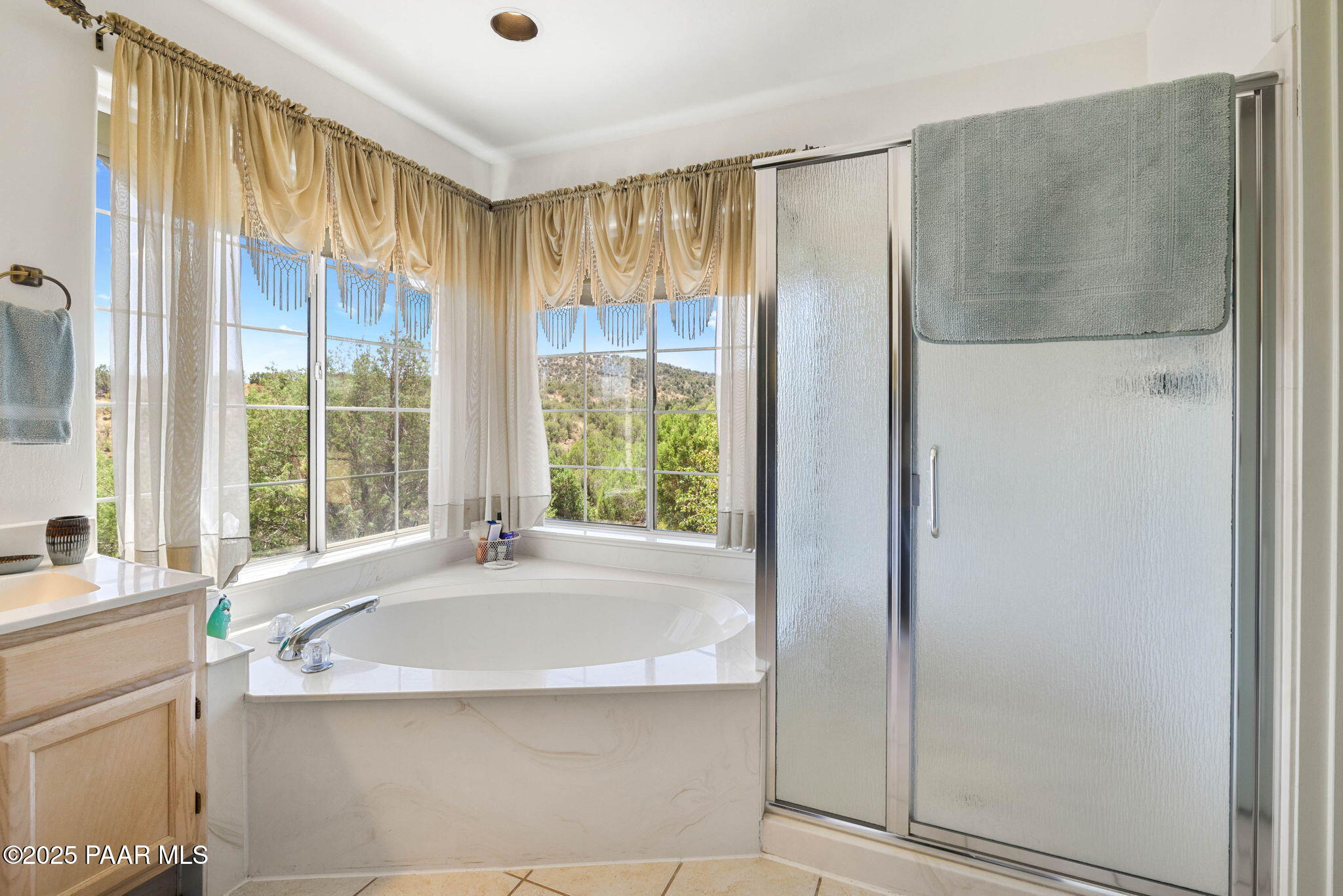 5400 North Skyhawk Road Chino Valley, AZ 86323 - Photo 14 of 26 a bath tub sitting in a bathroom next to a window