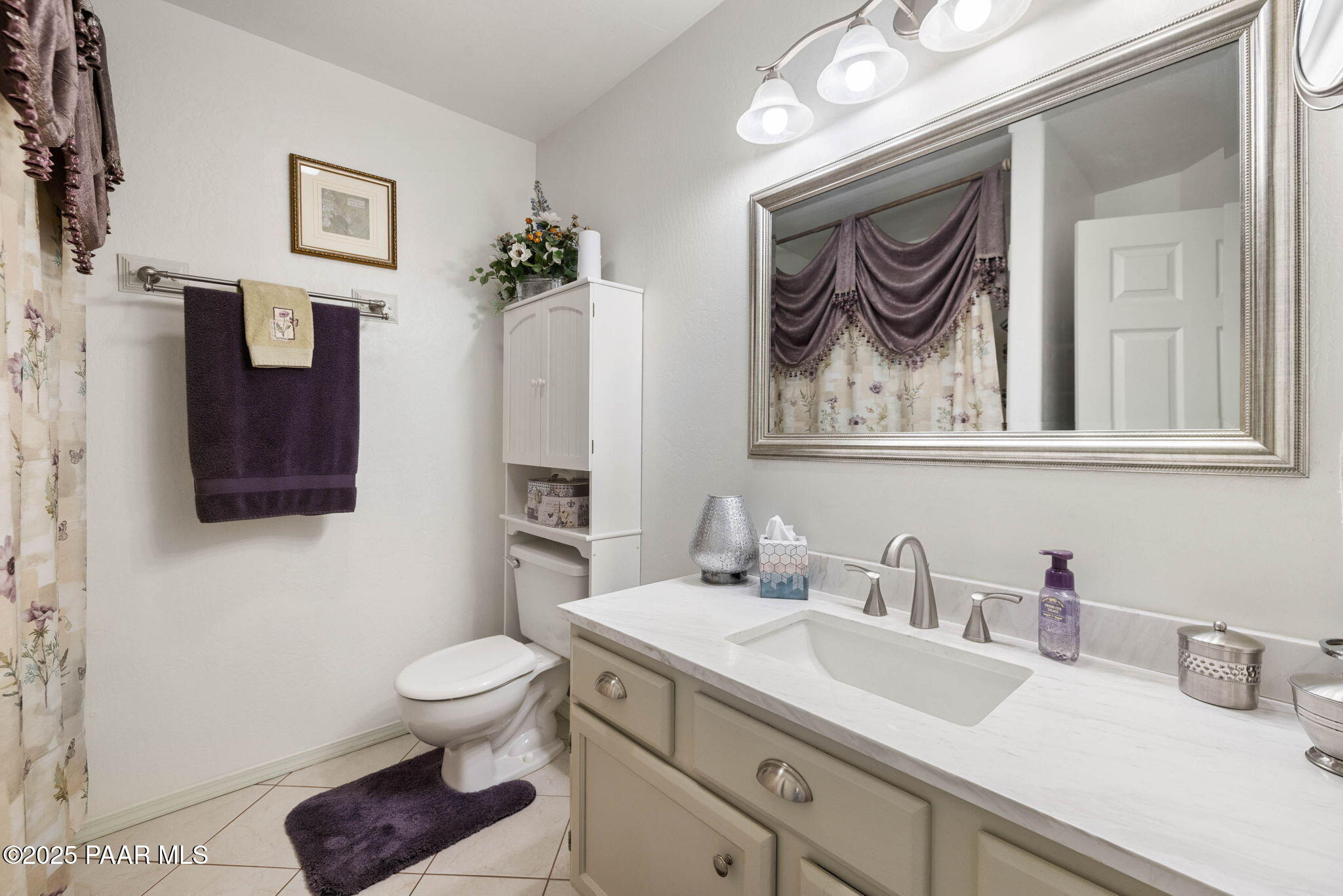 5400 North Skyhawk Road Chino Valley, AZ 86323 - Photo 17 of 26 a bathroom with a toilet a sink and mirror