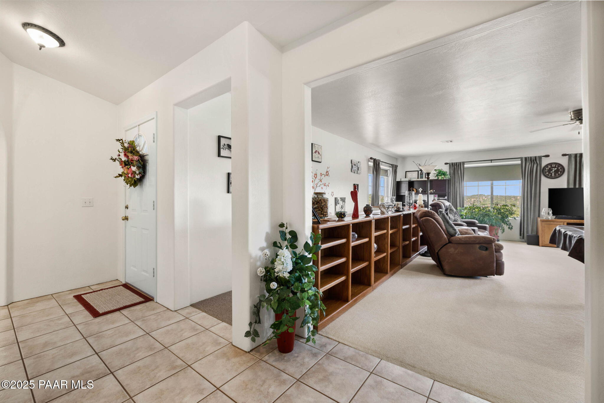 5400 North Skyhawk Road Chino Valley, AZ 86323 - Photo 4 of 26 a bedroom with furniture and a large window