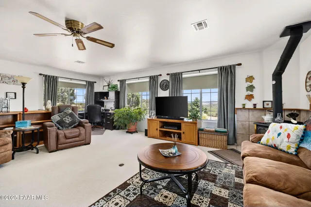 a living room with furniture and a rug