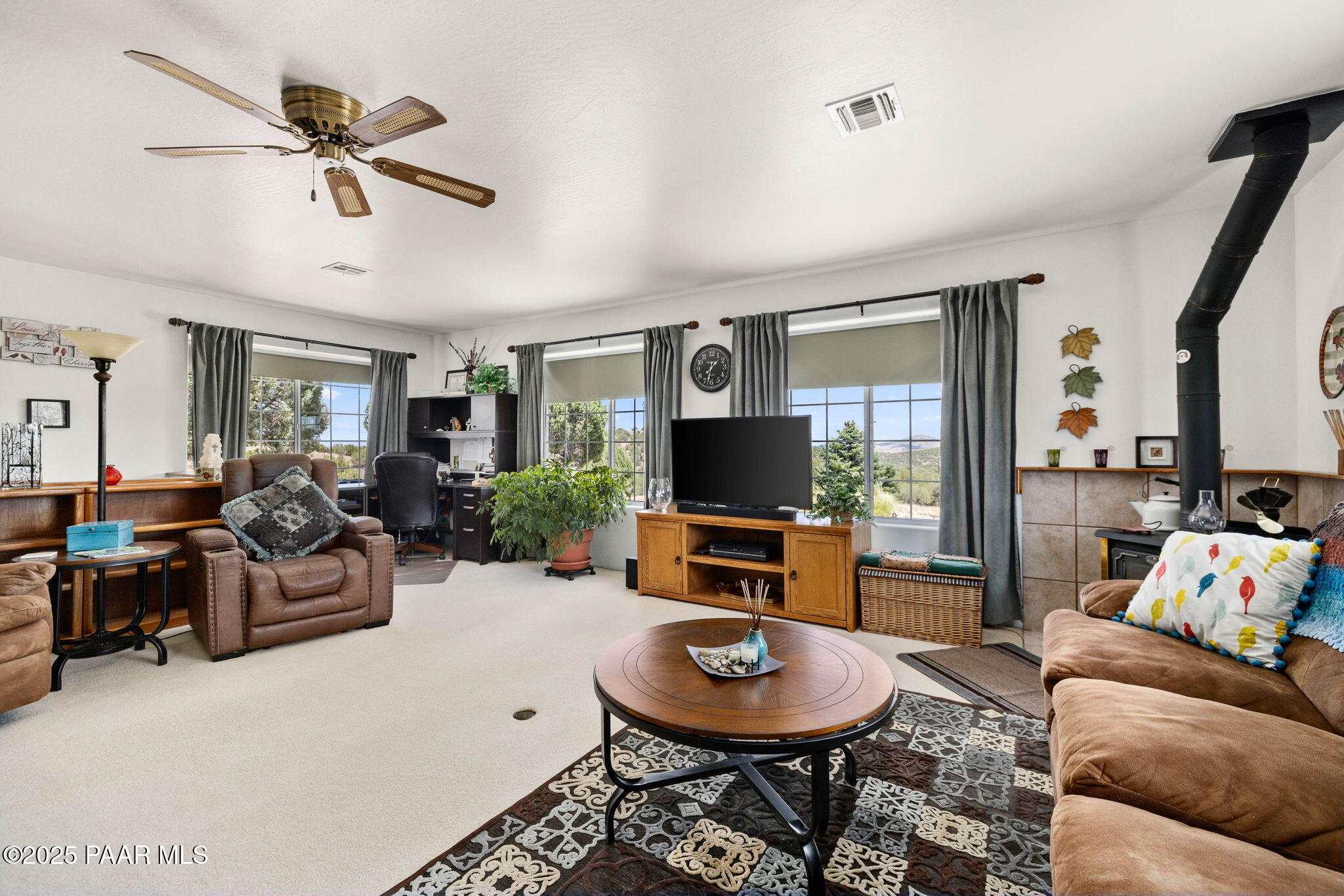 5400 North Skyhawk Road Chino Valley, AZ 86323 - Photo 6 of 26 a living room with furniture and a flat screen tv