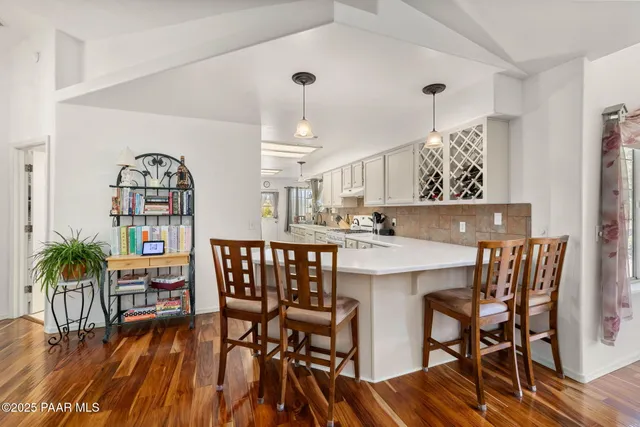 a kitchen with a sink cabinets and window