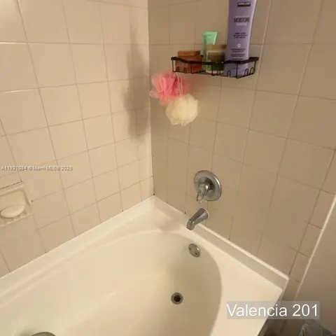 a bed sitting in a bedroom next to a small yard