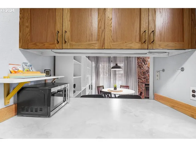 a kitchen with a sink and a stove top oven