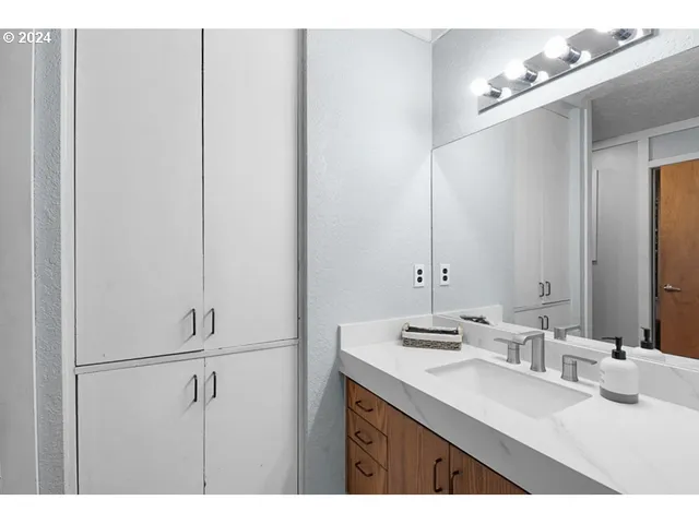 a bathroom with a sink and a mirror