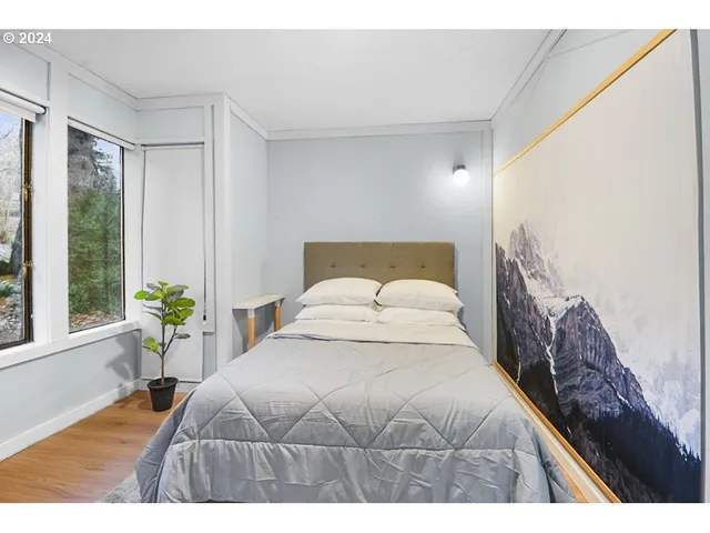 a bedroom with a bed and window