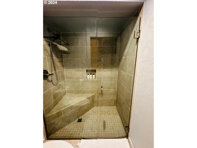 a backyard of a house with yard and outdoor seating