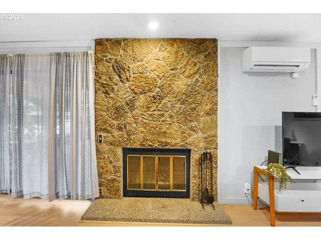 a black and white wall with a large window