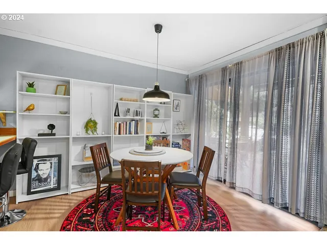 a dining room with furniture and window