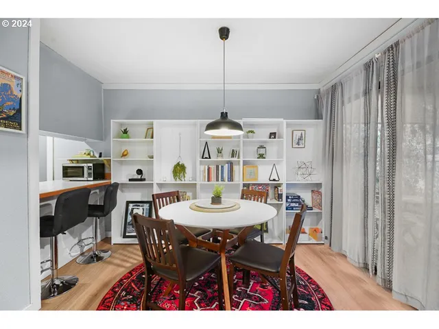 a dining room with furniture and window