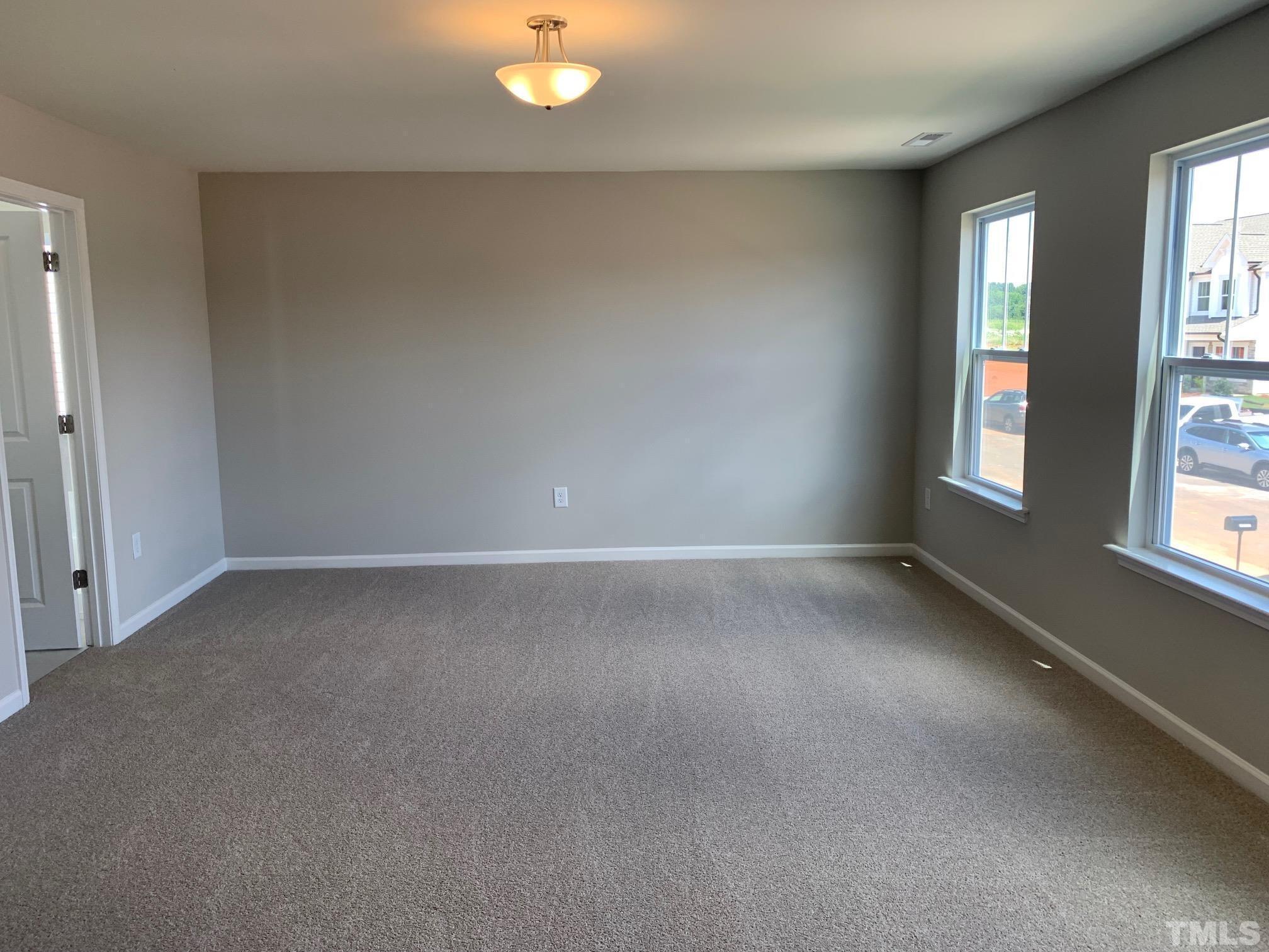 7104 Commodity Court Mebane, NC 27302 - Photo 16 of 32 an empty room with windows