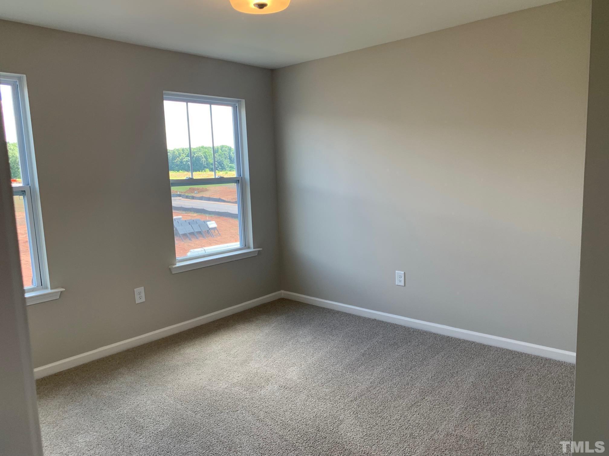7104 Commodity Court Mebane, NC 27302 - Photo 21 of 32 an empty room with a window