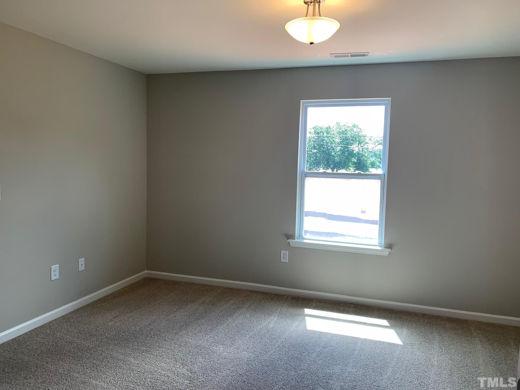7104 Commodity Court Mebane, NC 27302 - Photo 22 of 32 an empty room with a window