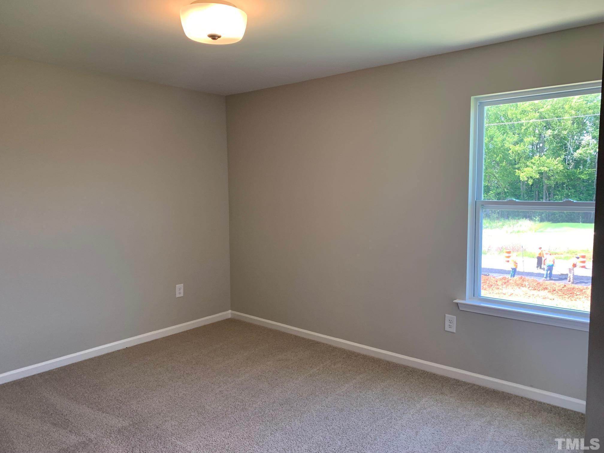 7104 Commodity Court Mebane, NC 27302 - Photo 23 of 32 an empty room with a window