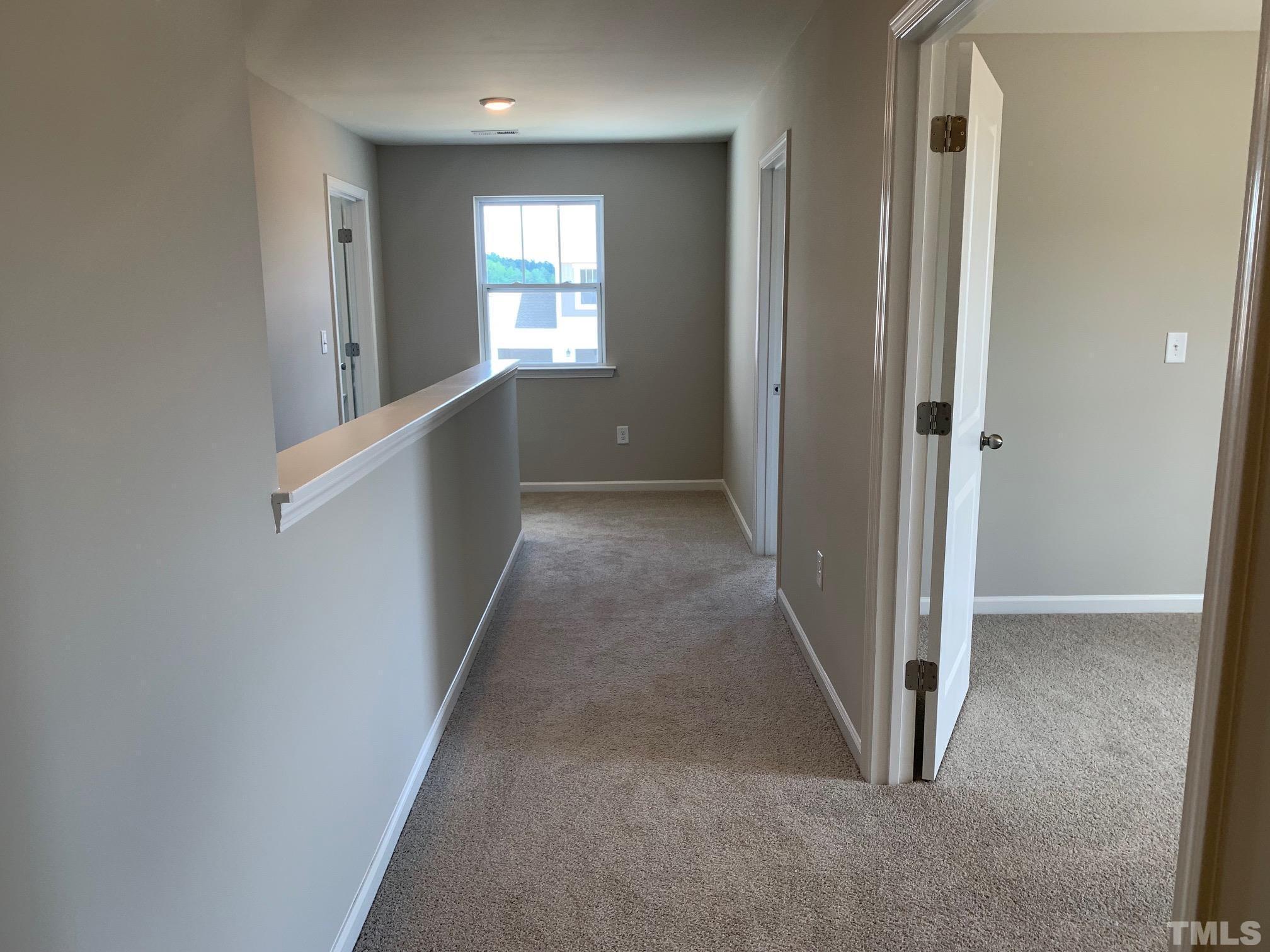 7104 Commodity Court Mebane, NC 27302 - Photo 24 of 32 a view of hallway with windows