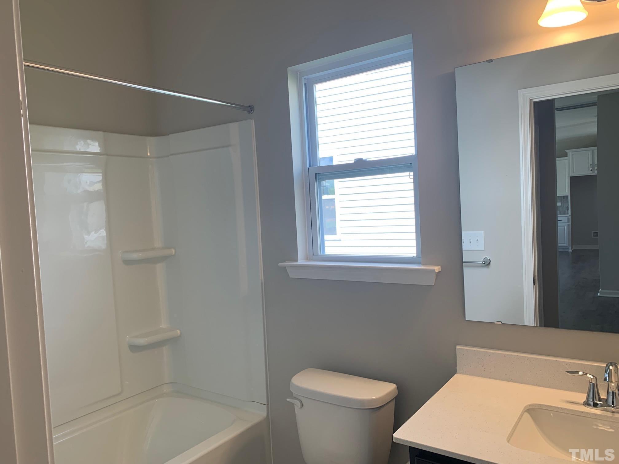 7104 Commodity Court Mebane, NC 27302 - Photo 6 of 32 a bathroom with a sink toilet and shower