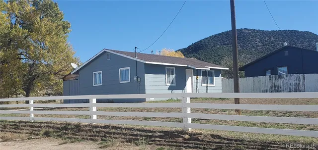 a front view of a house with a fence