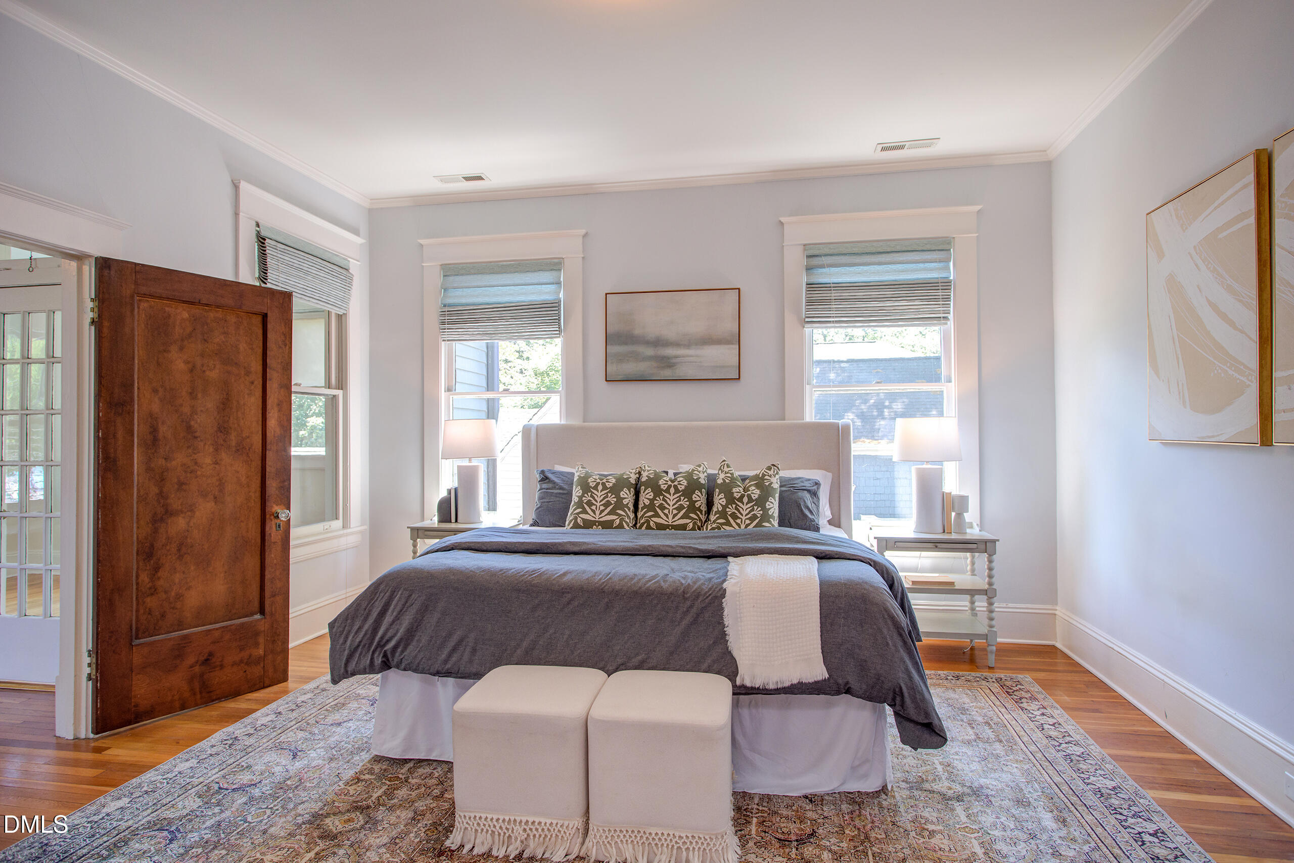 127 Forest Road Raleigh, NC 27605 - Photo 43 of 75 a bedroom with a bed and wooden floor