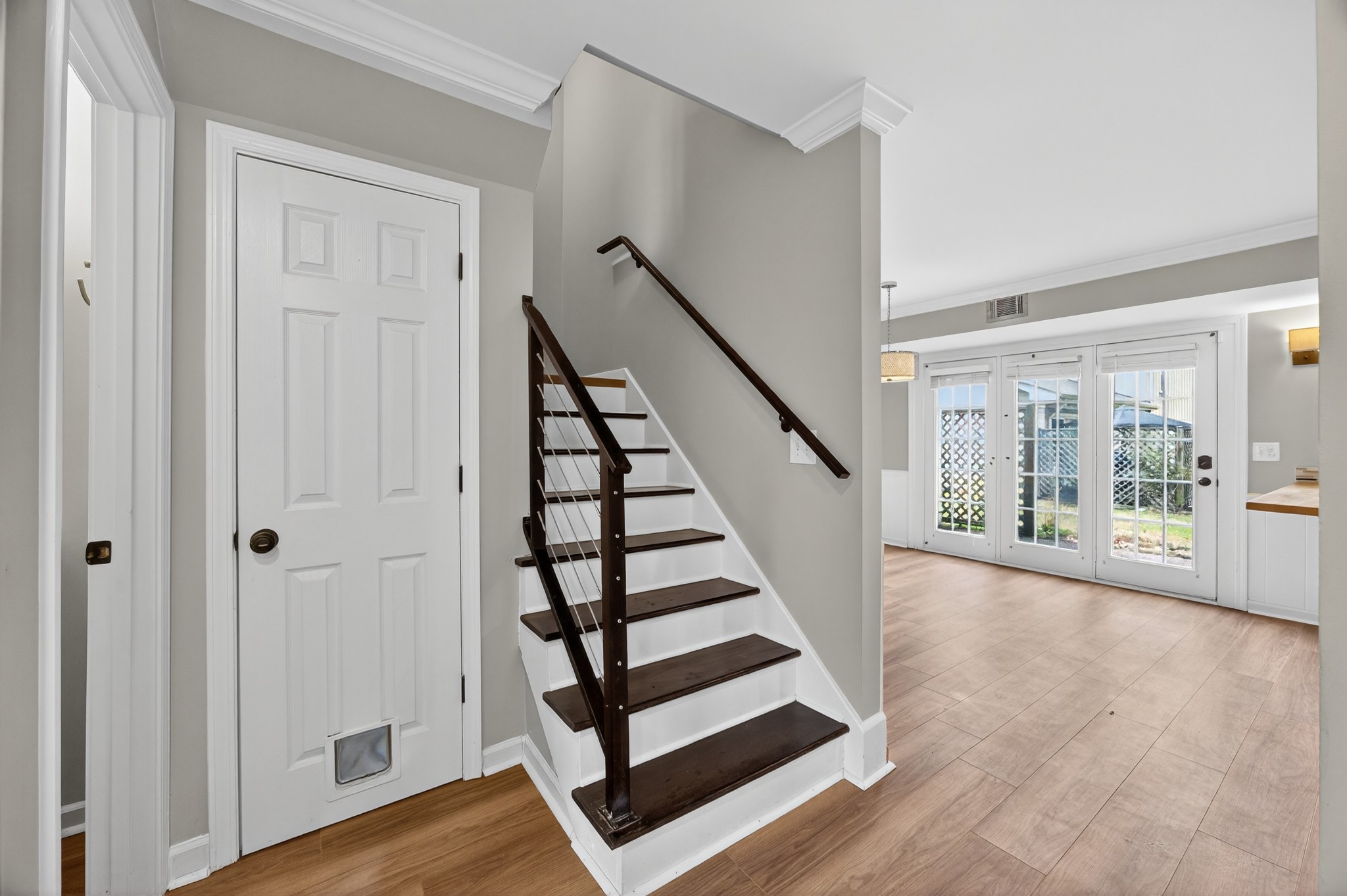1011 Murfreesboro Road, Unit J2 Franklin, TN 37064 - Photo 14 of 29 a view of front door with wooden floor and stairs