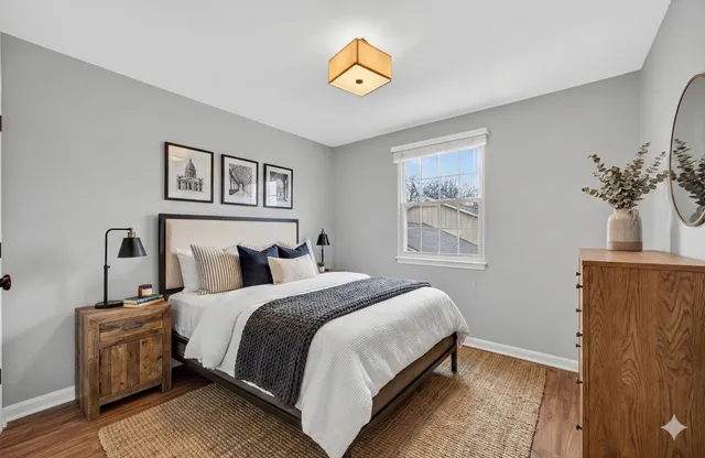 a bedroom with bed and a window