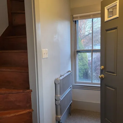 a room with walk in closet and a window
