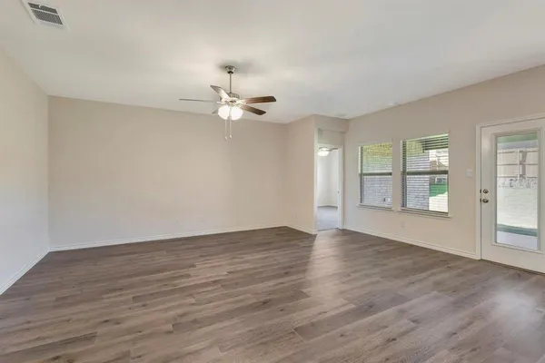 a view of an empty room with a window