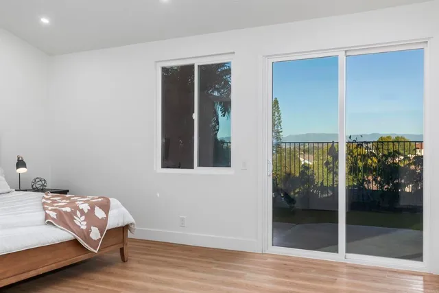 a spacious bathroom with a double vanity sink a mirror and a shower