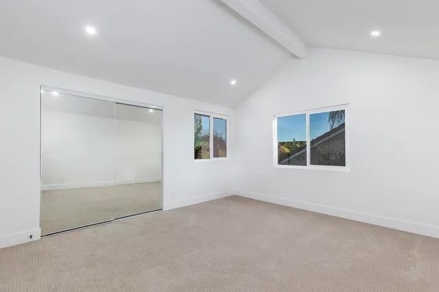 a bathroom with a double vanity sink mirror and toilet