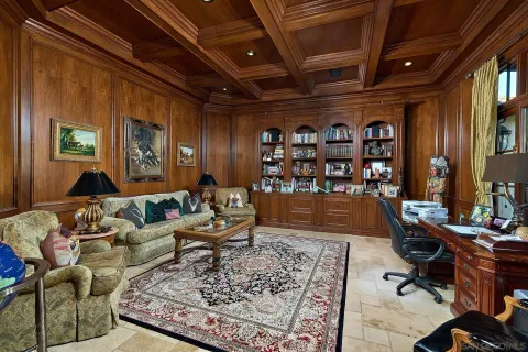 a living room with furniture or couch and a bookshelf