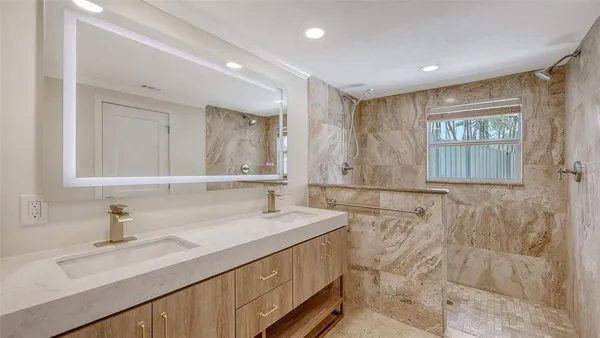 a bathroom with a sink and a mirror