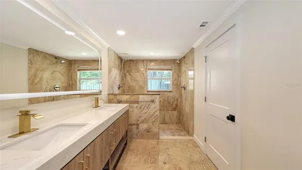 a bathroom with a bathtub and shower
