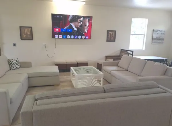 a sign board with a parking area