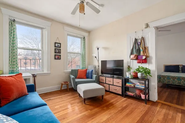 a living room with furniture and a flat screen tv