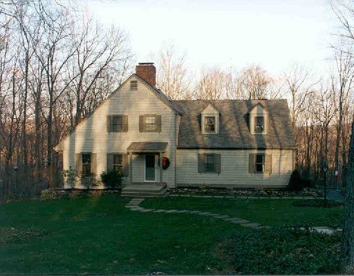 82 Saunders Lane Ridgefield, CT 06877 - Photo 1 of 1 a front view of a house with a yard