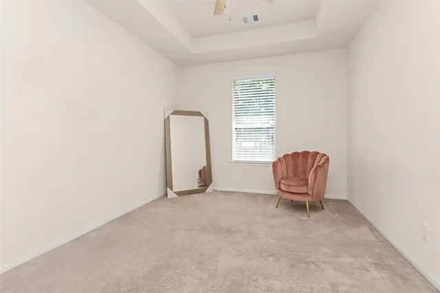 a room with a chair and a window