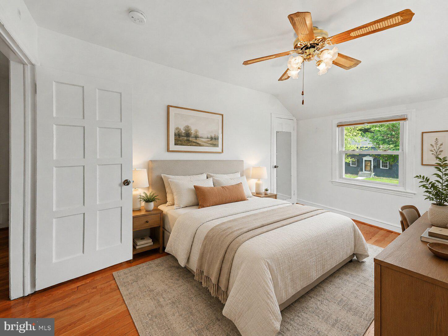 4504 20th Street Northeast Washington, DC 20018 - Photo 30 of 48 a bedroom with a bed and a chandelier