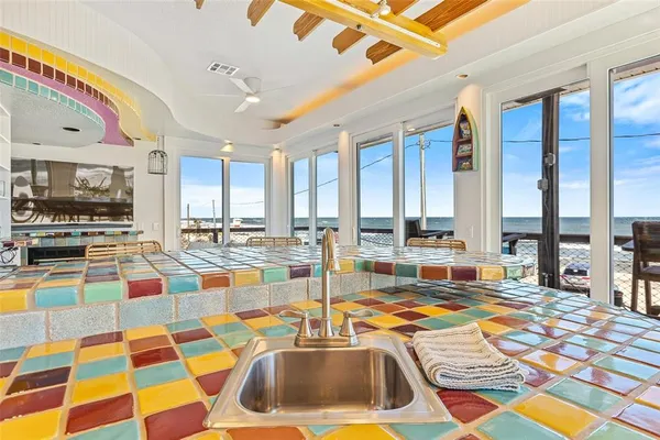 a view of a balcony with table and chairs