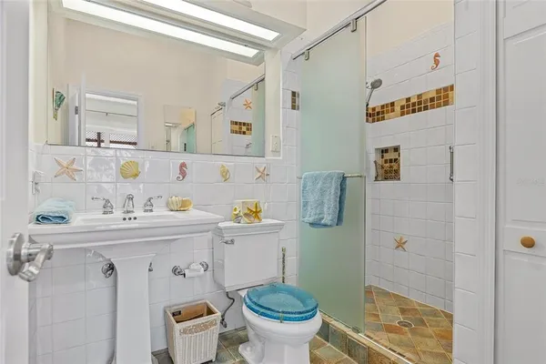 a bedroom with a bed and a mirror