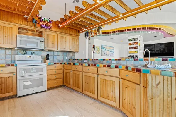 a view of a balcony with wooden floor