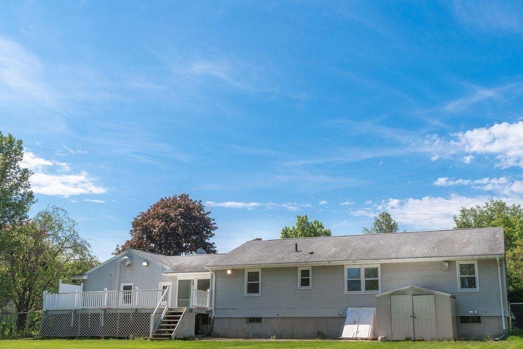 84 Bear Hole Road West Springfield, MA 01089 - Photo 8 of 37 a front view of a house with a yard
