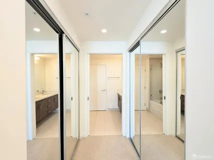 a bathroom with a glass shower door and a sink