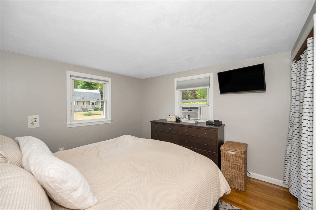 4 Governor Saltonstall Road Billerica, MA 01821 - Photo 11 of 25 a bedroom with a bed and a flat screen tv