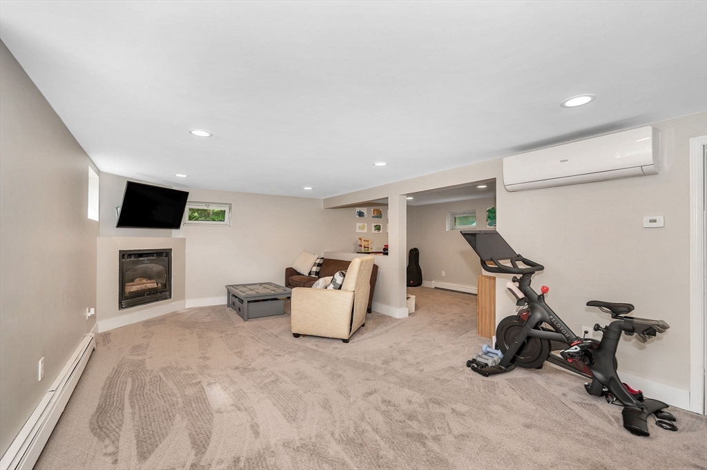 4 Governor Saltonstall Road Billerica, MA 01821 - Photo 17 of 25 a view of a livingroom with furniture and a flat screen tv