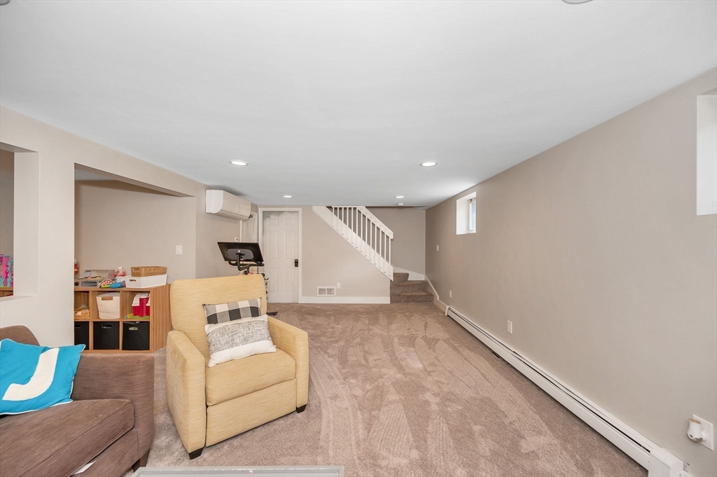 4 Governor Saltonstall Road Billerica, MA 01821 - Photo 19 of 25 a living room with furniture and a couch
