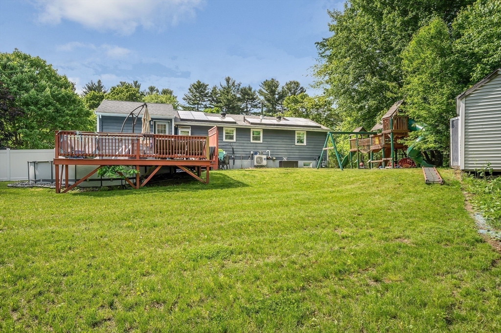 4 Governor Saltonstall Road Billerica, MA 01821 - Photo 25 of 25 a view of a house with a big yard and sitting area