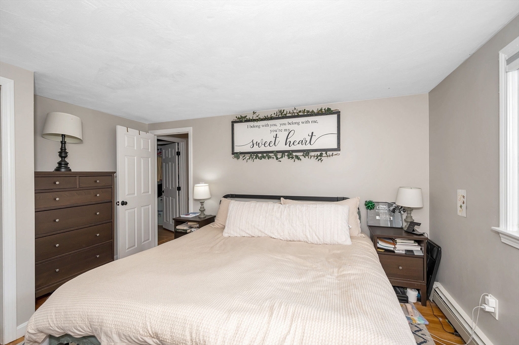 4 Governor Saltonstall Road Billerica, MA 01821 - Photo 10 of 25 a bedroom with a bed and a dresser