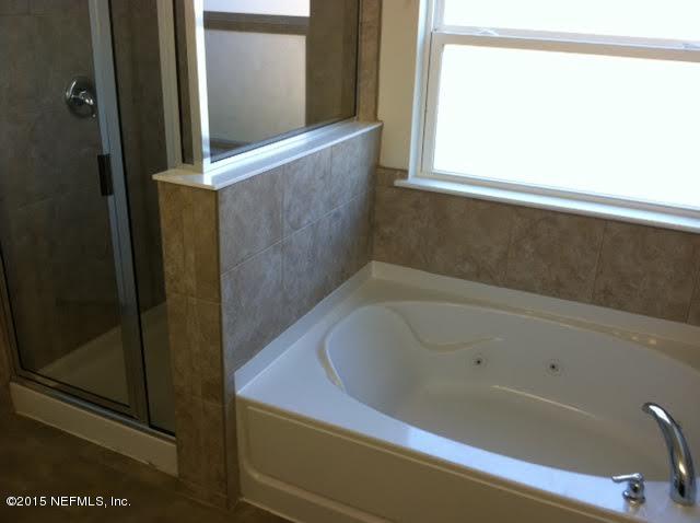 1198 Camp Ridge Lane Middleburg, FL 32068 - Photo 3 of 7 a bathroom with a bathtub