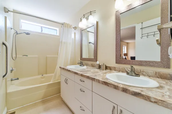 a white toilet sitting next to a bathroom sink