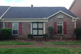 1018 General George Patton Road, Unit 1018 Nashville, TN 37221 - Photo 1 of 8 a front view of a house with garden
